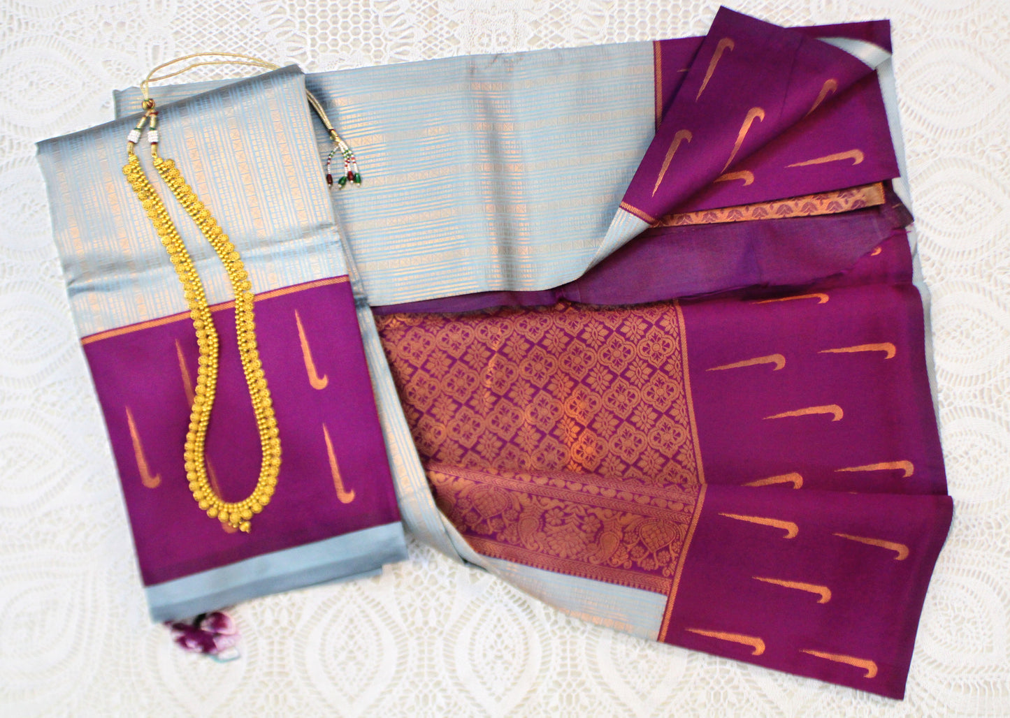 Close-up of Muniya butta border electric lavender blue saree—highlighting luminous weave and bold pastel brilliance.