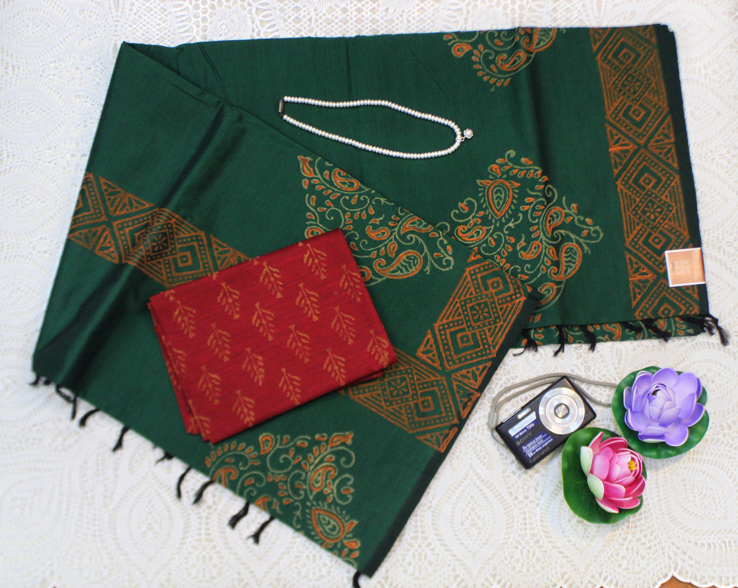Elegant semi-silk saree in dark green featuring traditional block patterns