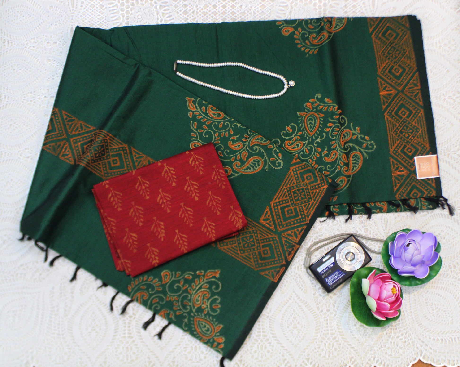 Elegant semi-silk saree in dark green featuring traditional block patterns