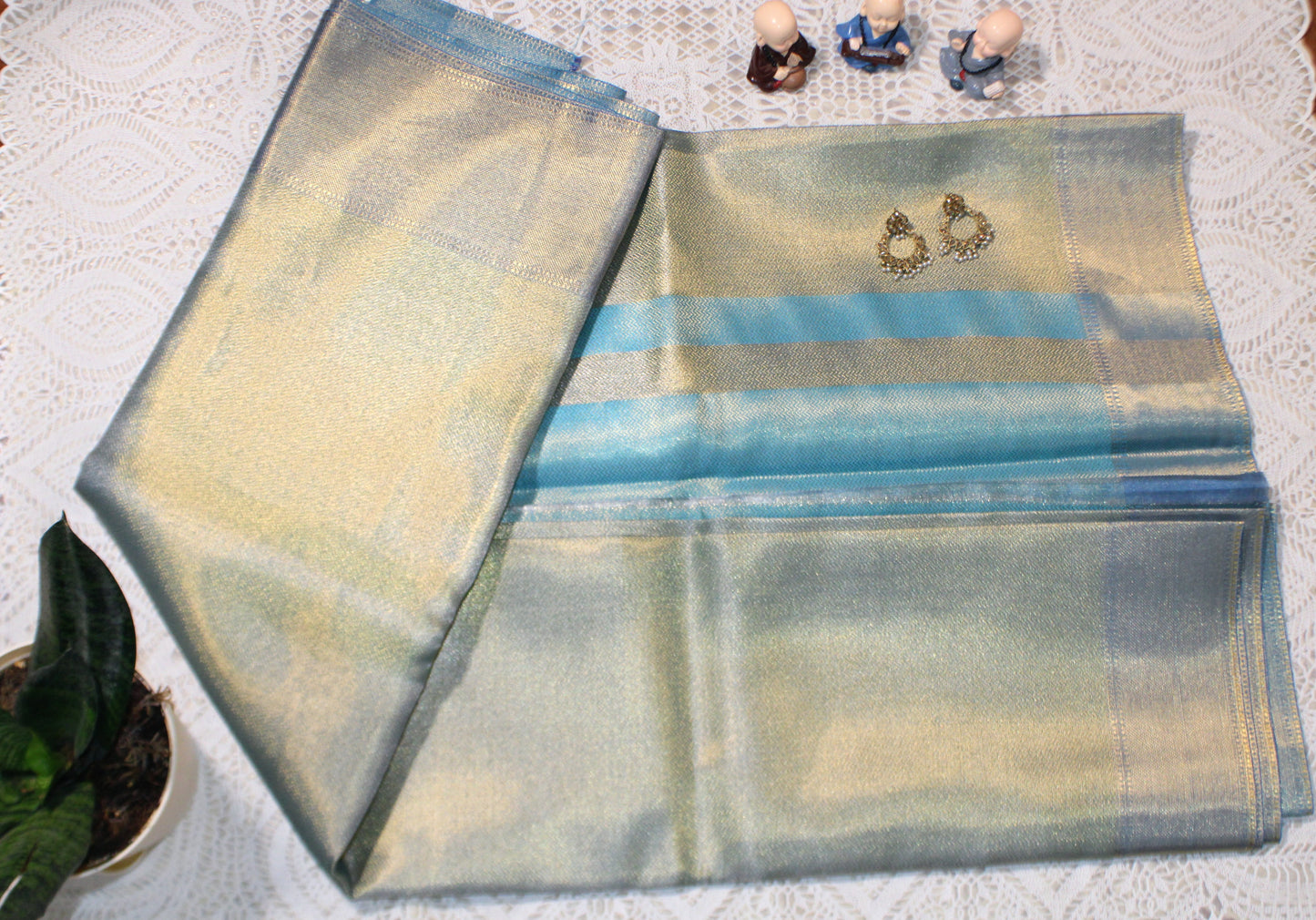 Blue saree with flowing pallu and shimmering border—evoking Jyothika’s twilight elegance and festive sophistication.