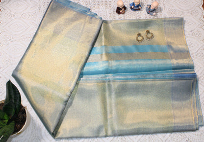 Blue saree with flowing pallu and shimmering border—evoking Jyothika’s twilight elegance and festive sophistication.