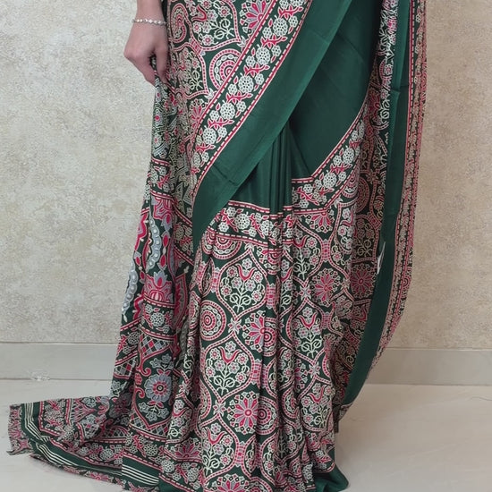 Woman wearing Modal Silk Saree with Ajrakh Allure print, styled for festive elegance