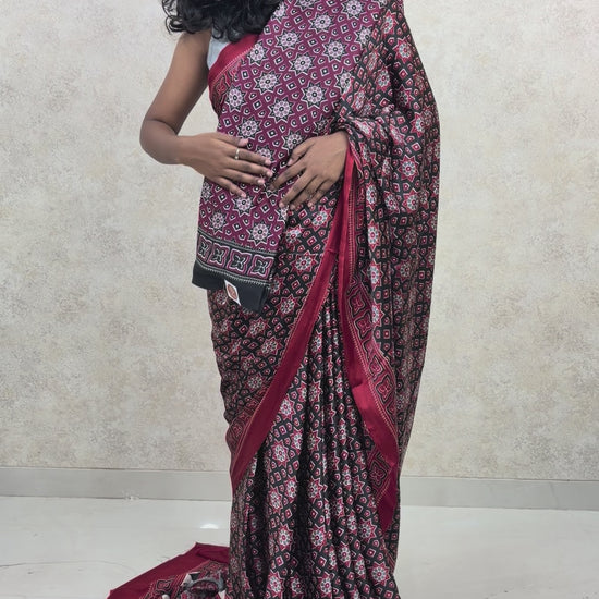 Model showcasing handcrafted Ajrakh Twilight print on flowing Modal Silk Saree