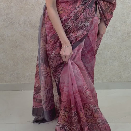 Graceful pose in Art Silk Saree with colorful leaf prints, perfect for cultural celebrations