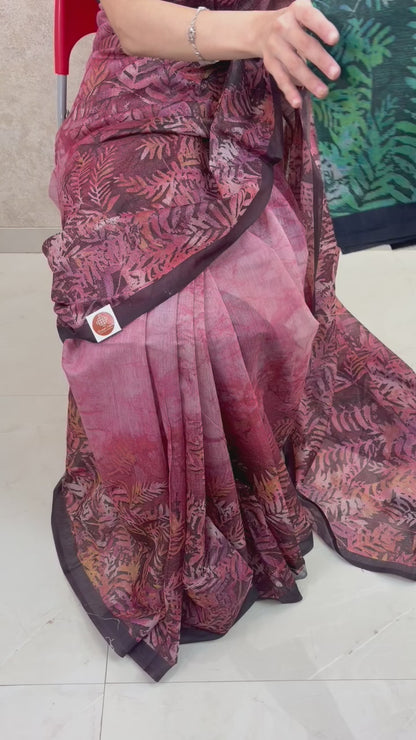 Female model showcasing Variants of Art Silk Saree with soft sheen and artistic leaf patterns